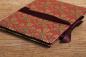 Preview: Handmade leporello with red cover paper and golden maple leaves, red ribbon for tying